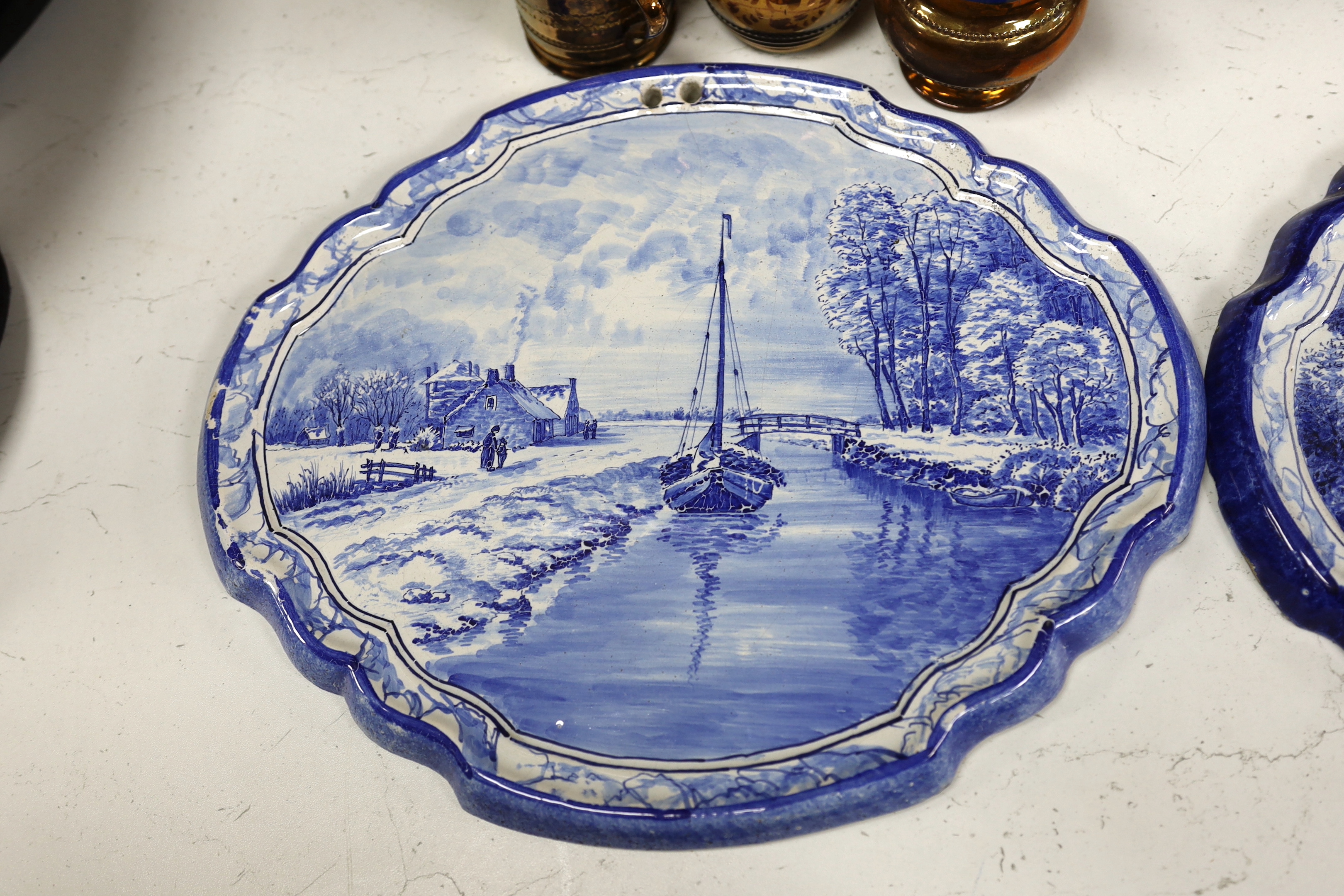 Nine ceramic items including two Dutch blue and white wall plaques, a silvered jug, a teapot, four items of lustreware and a Wedgwood jug, tallest 23cm
